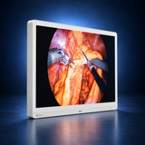 LG-32HR734S-W surgical monitor, angled front left view, white housing against a dark blue studio background.