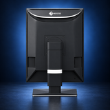 EIZO RadiForce RX270 monitor, rear view showing the black housing and stand on a dark blue studio background.