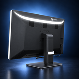EIZO RadiForce RX670 monitor, angled rear view showing the black housing and stand on a dark blue studio background.